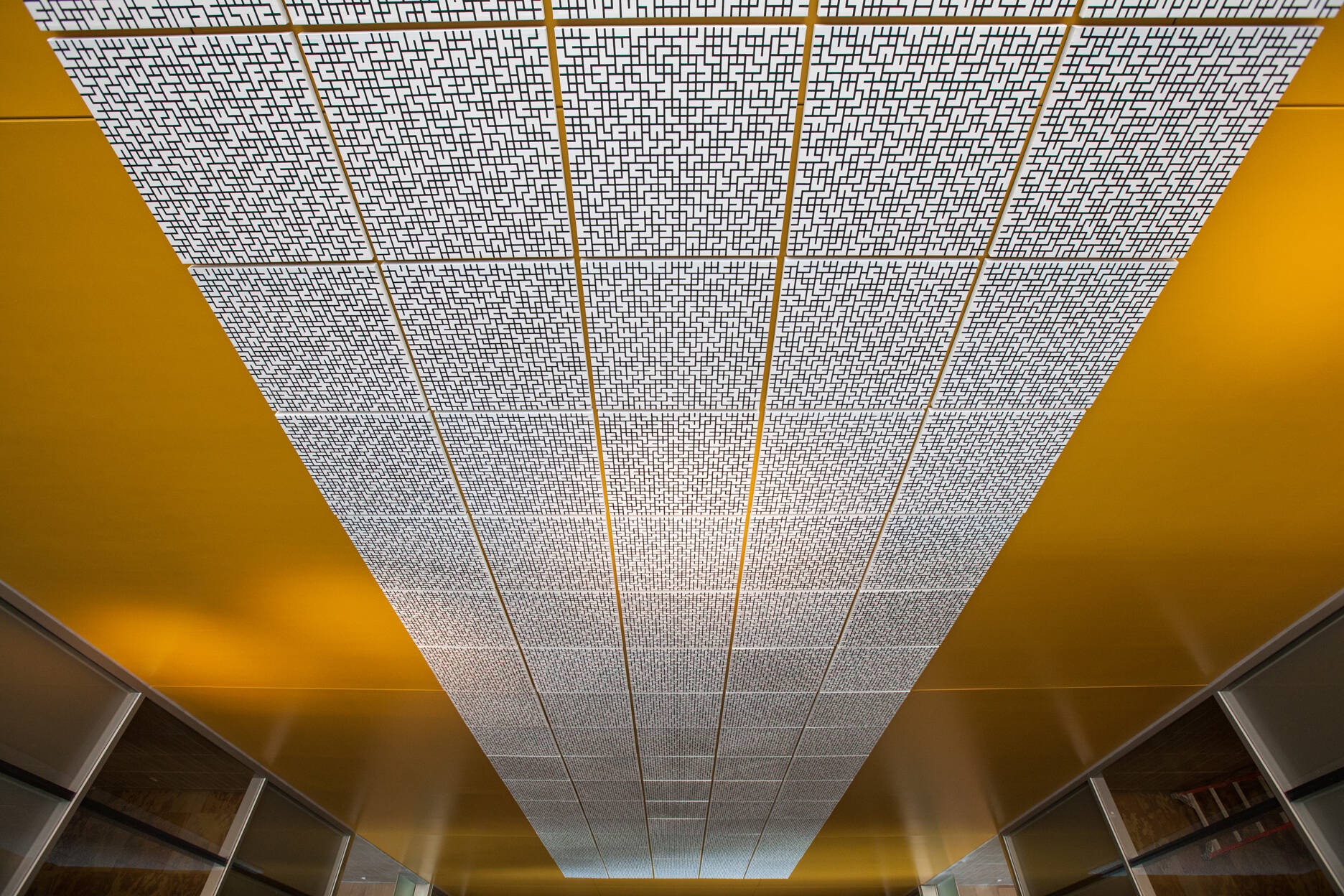 Multi-panel abstract pattern black and white patterns installed in the stairwell of the Mary Idema Pew Library